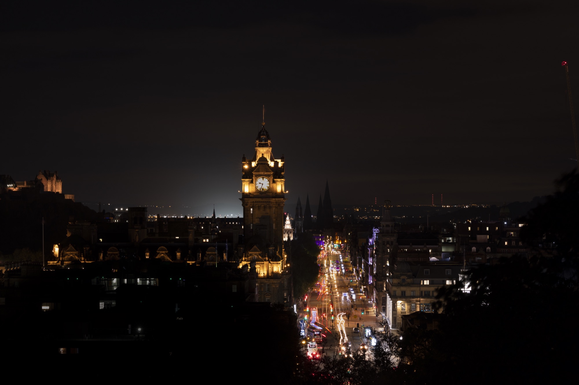 Edinburgh at night, with the illuminated Balmoral clock tower